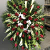 Premium red and white flowers on an easel 