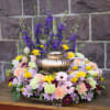 Round wreath with mixed flowers of carnations, daisies, gerber daisies and larkspur