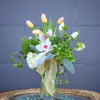 Lovely design including tulip, orchid, hydrangea and accents in a glass vase.