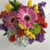 A designer choice arrangement designed with colorful seasonal blooms, based on availability.

Designed