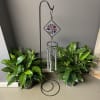 Double stained glass wind chimes with words of sympathy on the metal