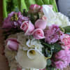 A lovely pastel theme arrangement, designed beautifully with roses, calla lilies, peonies