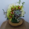 The green abundance of the rainforest is captured in this lovely bouquet