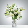 White lilies stand tall and beautiful. Send an impactful gift to somebody