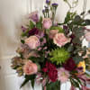 Beautiful rose arrangement, any colors that are available, with gorgeous composition touches