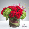 A gorgeous mix of fresh roses, hydrangeas, lilies, and special leaves to