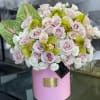 Beautiful arrangement with blush roses, hydrangeas, green orchids, and green anthuriums. 