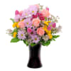 A variety of chrysanthemums combined with roses and tulips.
Approximately 7&quot;W X 13&quot;H