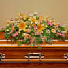Pay your respects with a divine mix of pink and yellow blossoms