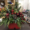 Fresh evergreens and pinecones and bows and berries, make this adorable metal