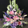 Pink &amp; Purple blooms arranged in a basket
