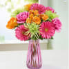 colorful mix of available flowers. comes in a colored or clear vase