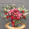 Beautiful design including stargazer lily, rose, orchid... and nice accents in a