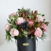 Featuring fresh flowers.
Adding Eryngium to this arrangement enhances creative thinking while soft