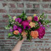 Snapdragons, peonies, and free spirit roses compliment each other and make this