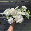 This arrangement is full of premium white and blush flowers. This arrangement