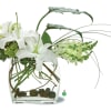 A bold display of white blossoms such as oriental lilies and snapdragons