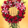 This is a gorgeous Standing Wreath of Red Roses and Lilys that