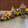 This beautiful serpentine style arrangement for an Urn display is a wonderful