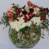 Oval vase with Orchids, Hydrangeas, spray roses, regular roses, scabiosa and hellebore