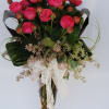 One dozen chic garden roses in tall glass vase with seeded eucalyptus