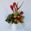 This is a beautiful mixture of topical flowers, roses, orchids and an