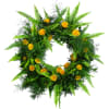 The circular shape of a wreath symbolizes never ending love. Yellow roses