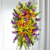 Our Thoughtful Prayers Standing Spray beautifully remembers their passion and radiance within
