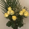 Yellow roses and a beautiful surrounding of texture of greenery