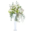 A posh combination of lilies, roses, hydrangea and accent flowers in a