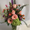 Soft colors arrangement with a high light of peach colors! So
Girly looking!