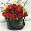 Jewel Tones consisting of red roses, gerber daisies and cymbidium orchids. 