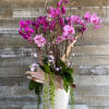 A blast of colorful blooms in pink and purple with bark wooden