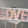 This arrangement will be prepared with approximately 30 preserved pink roses that