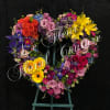 This beautiful sympathy heart is filled with a bountiful assortment of colorful