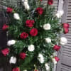 Classic floral statement of red and white roses in memory of your