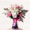 Pretty design including white and pastel pink fresh flowers and accents in