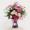Pretty design including white and pastel pink fresh flowers and accents in