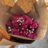 Send your loved ones a bouquet of pink roses and berries for