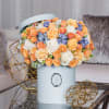 This blue variety of hatbox is full of peach roses with accents