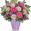 rafted of European glass with a shimmering pastel purple finish, this captivating