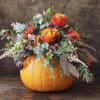This pumpkin is sure to please! Send your special someone fall flowers