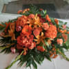 Beautiful rich coral/orange colors express deep sympathy to the loss of the