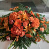 Beautiful rich coral/orange colors express deep sympathy to the loss of the