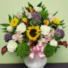 Shine some light with this amazing arrangement. Includes Calla Lilies, Sunflowers, Roses