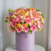 This is a gentle arrangement in warm shades of peach palette. It
