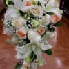 Roses, lilies and baby&#039;s breath.