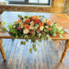 fall color roses and greenery