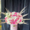 Stunning pretty pink roses, with an assortment of white roses and various