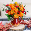 Two gorgeous autumnal gifts in one, this fabulous fall bouquet is arranged